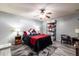 Comfortable main bedroom with ceiling fan, soft rug and coordinated decor at 5751 W Muriel Dr, Glendale, AZ 85308