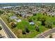 Aerial view of park featuring tennis courts, playgrounds, green space and nearby neighborhood at 5751 W Muriel Dr, Glendale, AZ 85308