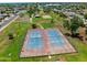 Aerial view of park featuring tennis courts, benches and lush green space at 5751 W Muriel Dr, Glendale, AZ 85308