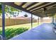 The covered patio is equipped with ceiling fans and string lights, offering a comfortable outdoor living space at 5751 W Muriel Dr, Glendale, AZ 85308