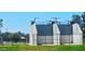 Outdoor racquetball courts with green lawns and mature trees offer recreational opportunities at 5751 W Muriel Dr, Glendale, AZ 85308