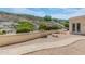 Serene backyard featuring a stone paver path, lush desert plants, and seating at 5949 W Pinnacle Hill Dr, Glendale, AZ 85310