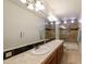 Spacious bathroom features double sinks, a large mirror, and a shower-tub combination, offering a serene and practical space at 5949 W Pinnacle Hill Dr, Glendale, AZ 85310