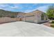 Spacious three-car garage with an extra-wide driveway, perfect for ample parking and storage at 5949 W Pinnacle Hill Dr, Glendale, AZ 85310