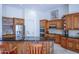 Modern kitchen featuring a center island with seating, custom cabinets, and stainless steel appliances at 5949 W Pinnacle Hill Dr, Glendale, AZ 85310