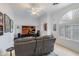 Bright living room with a large TV, comfortable seating, and stylish window shutters, perfect for relaxation and entertainment at 5949 W Pinnacle Hill Dr, Glendale, AZ 85310