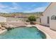 Inviting pool area with a waterfall feature and brick patio, perfect for relaxing and entertaining outdoors at 5949 W Pinnacle Hill Dr, Glendale, AZ 85310