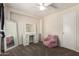 Cozy bedroom with a comfy chair, vanity and mirror, great for relaxation or study at 6033 W Wood St, Phoenix, AZ 85043