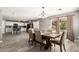 Bright dining room with wood floors and a large glass door to the backyard at 6033 W Wood St, Phoenix, AZ 85043