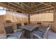 Cozy gazebo with outdoor dining set, offering a relaxing space for outdoor entertaining at 6033 W Wood St, Phoenix, AZ 85043