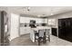 The kitchen features white cabinets and stainless steel appliances at 6033 W Wood St, Phoenix, AZ 85043