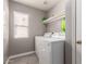 Practical laundry room with modern washer and dryer, efficient for your laundry needs at 6033 W Wood St, Phoenix, AZ 85043