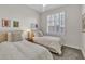 Bright bedroom featuring twin beds, neutral decor, and plantation shutters allowing soft, natural light at 6135 E Campo Bello Dr, Scottsdale, AZ 85254