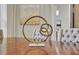 Dining table with decorative circles on the table and upholstered chairs at 6135 E Campo Bello Dr, Scottsdale, AZ 85254