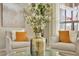 Intimate living room setting with comfortable armchairs, stylish cushions, and a glass coffee table at 6135 E Campo Bello Dr, Scottsdale, AZ 85254
