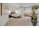 Spacious main bedroom with carpet, windows with plantation shutters and ceiling fan at 6135 E Campo Bello Dr, Scottsdale, AZ 85254