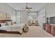 Spacious main bedroom with carpet, windows with plantation shutters and ceiling fan at 6135 E Campo Bello Dr, Scottsdale, AZ 85254