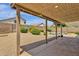 Relaxing backyard view with a covered patio, lush landscaping and a refreshing pool at 6602 W Lariat Ln, Phoenix, AZ 85083