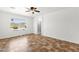 Bright bedroom with a ceiling fan, tiled floors and a window overlooking the pool at 6602 W Lariat Ln, Phoenix, AZ 85083
