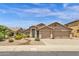 Inviting desert home featuring a two-car garage and xeriscaped front yard at 6602 W Lariat Ln, Phoenix, AZ 85083