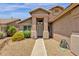 Home with desert landscape and a covered entryway leading to the front door at 6602 W Lariat Ln, Phoenix, AZ 85083
