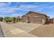 Spacious two-car garage with a large driveway and desert-friendly landscaping at 6602 W Lariat Ln, Phoenix, AZ 85083