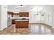 Open floor plan featuring kitchen with island, wood cabinets, and stainless steel appliances at 6602 W Lariat Ln, Phoenix, AZ 85083