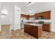 Spacious kitchen with stainless steel appliances, a center island, and warm wood cabinets at 6602 W Lariat Ln, Phoenix, AZ 85083