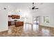 Open floor plan featuring kitchen with island and living room with tile floors at 6602 W Lariat Ln, Phoenix, AZ 85083