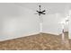 Spacious living room featuring tile flooring and a ceiling fan at 6602 W Lariat Ln, Phoenix, AZ 85083