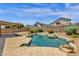 Inviting backyard pool and lush landscaping are perfect for summer fun and relaxation at 6602 W Lariat Ln, Phoenix, AZ 85083