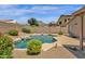 Beautiful backyard pool featuring rock accents, mature landscaping, and privacy at 6602 W Lariat Ln, Phoenix, AZ 85083