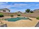 Sparkling pool surrounded by desert landscaping and a block wall for privacy at 6602 W Lariat Ln, Phoenix, AZ 85083