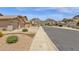 Scenic street view with well-maintained homes, desert landscaping and mountain views at 6602 W Lariat Ln, Phoenix, AZ 85083