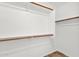 Walk-in closet with wood shelving at 6602 W Lariat Ln, Phoenix, AZ 85083