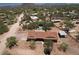 Stunning aerial perspective showcasing the property, desert foliage, and mountain backdrop at 6608 E Ranch Rd, Cave Creek, AZ 85331