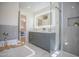 Modern bathroom featuring double vanity, stylish mirror, glass shower, and soaking tub at 6608 E Ranch Rd, Cave Creek, AZ 85331