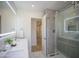 Modern bathroom featuring a double sink vanity, marble floors, and a glass enclosed shower at 6608 E Ranch Rd, Cave Creek, AZ 85331