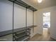 Organized walk-in closet with modern shelving and hanging rods, offering ample storage space at 6608 E Ranch Rd, Cave Creek, AZ 85331