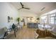 Bright, open dining area features a modern table set and flows into the kitchen with bar seating at 6608 E Ranch Rd, Cave Creek, AZ 85331
