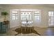 Bright dining nook features a stylish table set with pendant lighting and a view to the outdoors at 6608 E Ranch Rd, Cave Creek, AZ 85331