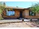 Charming single-Gathering home featuring a classic brick facade and a cozy front entrance at 6608 E Ranch Rd, Cave Creek, AZ 85331