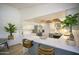 Bright kitchen boasts white cabinets, a breakfast bar, and stainless steel appliances at 6608 E Ranch Rd, Cave Creek, AZ 85331