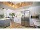 Modern kitchen featuring stainless steel appliances, ample counter space, and unique overhead beams at 6608 E Ranch Rd, Cave Creek, AZ 85331