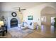 Inviting living room featuring a fireplace, comfortable seating, and seamless transition to other spaces at 6608 E Ranch Rd, Cave Creek, AZ 85331