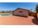 Backyard view with pool, enclosed by a fence, and a low-maintenance desert landscape at 662 W Laguna Azul Ave, Mesa, AZ 85210