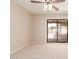 Bright bedroom with beige carpet and a sliding glass door leading to the patio at 662 W Laguna Azul Ave, Mesa, AZ 85210