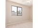 Inviting bedroom with neutral carpet and a window overlooking the backyard at 662 W Laguna Azul Ave, Mesa, AZ 85210