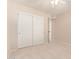 Cozy carpeted bedroom features a large closet and a neutral color palette for versatile decorating at 662 W Laguna Azul Ave, Mesa, AZ 85210