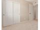 Bedroom features plush carpet, double closets, and easy access to the hallway at 662 W Laguna Azul Ave, Mesa, AZ 85210